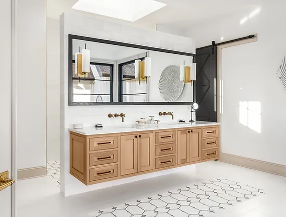 Bathroom in new luxury home with floating double vanity large mirror wood cabinets and